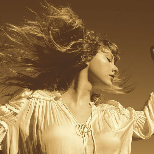 the album cover for Taylor Swift - Fearless: Taylor's Version [Gold 3 LP]